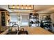 Bright kitchen features stainless steel appliances, an island with a sink, and natural light from the windows at 6051 106Th N Ave, Pinellas Park, FL 33782