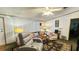 Comfortable living area with stylish seating, decorative rugs and accent lighting at 6051 106Th N Ave, Pinellas Park, FL 33782