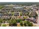Birds eye view of a well maintained community with houses near ponds and other community spaces at 6111 Hadley Commons Dr, Riverview, FL 33578