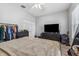 Spacious bedroom featuring a closet, tv, and neutral walls at 6111 Hadley Commons Dr, Riverview, FL 33578