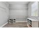 Walk-in closet with built-in shelving and storage; perfect for organization at 6111 Hadley Commons Dr, Riverview, FL 33578