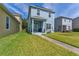 Beautiful two-story home featuring a cozy front porch perfect for outdoor living and entertaining at 6111 Hadley Commons Dr, Riverview, FL 33578