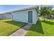Exterior of a guest house featuring a neutral paint, simple roofline, and mature landscaping at 6111 Hadley Commons Dr, Riverview, FL 33578