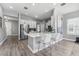 Open kitchen with stainless steel appliances, an island with seating, and modern finishes at 6111 Hadley Commons Dr, Riverview, FL 33578