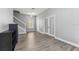 Living room featuring wood floors, a ceiling fan, and French doors at 6111 Hadley Commons Dr, Riverview, FL 33578