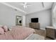 Inviting main bedroom showcasing a king bed, lots of natural light, and neutral decor at 6111 Hadley Commons Dr, Riverview, FL 33578
