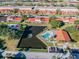 Aerial view of a community with pond, swimming pool and assigned parking spaces at 7360 Ulmerton Rd # 29B, Largo, FL 33771