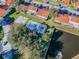 Aerial view showing a community pool and pond within a neighborhood at 7360 Ulmerton Rd # 29B, Largo, FL 33771