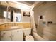 Bathroom features a vanity with a granite countertop, shower and tub combo, and a large mirror for a practical design at 7360 Ulmerton Rd # 29B, Largo, FL 33771