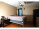 Cozy bedroom with a neutral color scheme, ceiling fan, and natural light offers a peaceful retreat at 7360 Ulmerton Rd # 29B, Largo, FL 33771