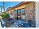 Charming villa featuring a brick facade and a cozy front patio with seating for outdoor enjoyment at 7360 Ulmerton Rd # 29B, Largo, FL 33771