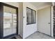 Inviting front porch with a secure glass door and storm door; offering additional entry storage at 7360 Ulmerton Rd # 29B, Largo, FL 33771
