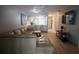 Comfortable living room with open access to the kitchen, creating a seamless flow for modern living and entertaining at 7360 Ulmerton Rd # 29B, Largo, FL 33771