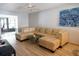 Spacious living room features a comfortable sectional sofa, wood-look floors, and stylish decor, creating a relaxing atmosphere at 7360 Ulmerton Rd # 29B, Largo, FL 33771