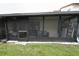 A shady sunroom, including some storage space, attached to a home at 7360 Ulmerton Rd # 29B, Largo, FL 33771