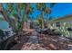 Private backyard featuring tropical plants, paved path and outdoor seating at 810 Lantana Ave, Clearwater Beach, FL 33767
