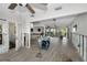 Large open living room with light grey floors and lots of natural light at 810 Lantana Ave, Clearwater Beach, FL 33767