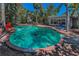 Beautifully landscaped backyard pool with a brick surround and comfortable lounge chairs at 810 Lantana Ave, Clearwater Beach, FL 33767