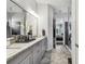 Beautiful bathroom with double vanity, granite countertops, and a walk-in shower at 8725 Sorano Villa Dr, Tampa, FL 33647