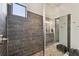 Modern tiled walk-in shower featuring elegant fixtures at 8725 Sorano Villa Dr, Tampa, FL 33647