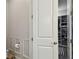 Bathroom featuring an open closet and a toilet paper holder at 8725 Sorano Villa Dr, Tampa, FL 33647