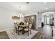 Dining room features hardwood floors and modern lighting at 8725 Sorano Villa Dr, Tampa, FL 33647
