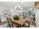 Open concept dining room with kitchen and living room views and modern lighting at 8725 Sorano Villa Dr, Tampa, FL 33647