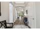 Welcoming entryway featuring hardwood floors and an open view of the living space at 8725 Sorano Villa Dr, Tampa, FL 33647