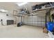 Spacious garage with epoxy flooring, storage racks, and ample space for vehicles and storage, providing practicality at 8725 Sorano Villa Dr, Tampa, FL 33647
