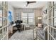 Bright and spacious home office with ample desk space, comfortable seating, and plenty of natural light at 8725 Sorano Villa Dr, Tampa, FL 33647