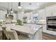 Spacious kitchen featuring a large island with granite counters, stainless steel appliances, and ample counter space for cooking at 8725 Sorano Villa Dr, Tampa, FL 33647