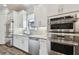 Modern kitchen with stainless steel appliances and white cabinetry at 8725 Sorano Villa Dr, Tampa, FL 33647