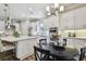 Bright kitchen with stainless appliances, granite counters, and an island connecting to the dining area, ideal for Gathering gatherings at 8725 Sorano Villa Dr, Tampa, FL 33647