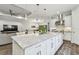 Inviting kitchen featuring a large granite island, stainless steel appliances, and an open layout perfect for entertaining guests at 8725 Sorano Villa Dr, Tampa, FL 33647