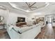 Comfortable living room showcasing hardwood floors and tray ceilings at 8725 Sorano Villa Dr, Tampa, FL 33647