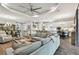 Open concept living space featuring modern kitchen and comfortable living room at 8725 Sorano Villa Dr, Tampa, FL 33647