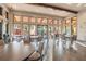 Spacious community lounge with sleek tables, chairs, and views of outdoor recreational facilities at 8725 Sorano Villa Dr, Tampa, FL 33647