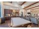 Community lounge features a kitchen area, pool table, and seating for residents at 8725 Sorano Villa Dr, Tampa, FL 33647
