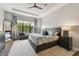 Spacious bedroom filled with natural light, a large window, and a comfortable bed at 8725 Sorano Villa Dr, Tampa, FL 33647
