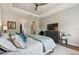 Inviting bedroom featuring comfortable bedding, ample storage, and a mounted TV at 8725 Sorano Villa Dr, Tampa, FL 33647