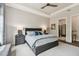 Bright and spacious main bedroom with ceiling fan and en-suite bathroom at 8725 Sorano Villa Dr, Tampa, FL 33647