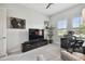 Home office featuring a work area with a desk, a large television, and windows with views to the outdoors at 8725 Sorano Villa Dr, Tampa, FL 33647