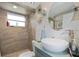 Modern bathroom featuring vessel sink, updated shower, and decorative accents at 9825 Casey Dr, New Port Richey, FL 34654