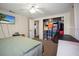 Bedroom includes closet, ceiling fan, closet, and TV at 9825 Casey Dr, New Port Richey, FL 34654