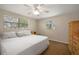 This bedroom has ample natural light and neutral walls and flooring at 9825 Casey Dr, New Port Richey, FL 34654