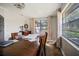 The dining room has natural lighting and classic, neutral decor at 9825 Casey Dr, New Port Richey, FL 34654