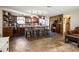 Gourmet kitchen featuring a stone island, stainless steel appliances, and a wood-accent wall at 9825 Casey Dr, New Port Richey, FL 34654