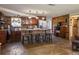 Kitchen with stone counter seating, stainless steel appliances, and unique stone flooring at 9825 Casey Dr, New Port Richey, FL 34654