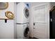 Convenient laundry area with stacked washer and dryer near door at 9825 Casey Dr, New Port Richey, FL 34654