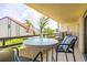 Cozy balcony with comfortable seating, perfect for enjoying the peaceful neighborhood views at 103 1St E St # 115, Tierra Verde, FL 33715
